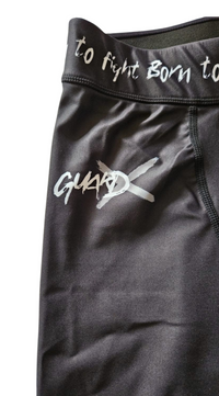 Close-up of GearX black spats waistband and upper leg area