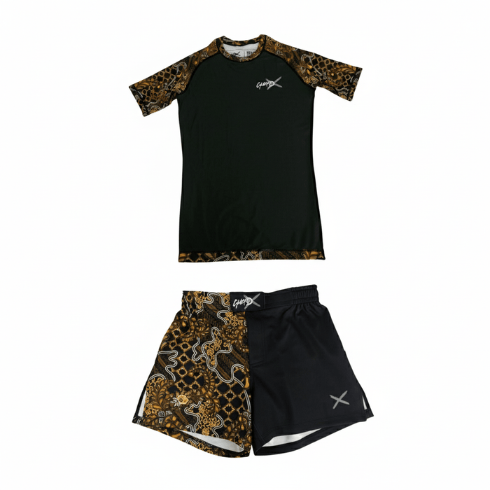 Batik-X Inferno short sleeve rashguard and matching fight shorts set, black compression top with yellow and brown batik design, designed for BJJ and MMA.