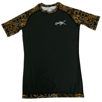 Batik-X Inferno short sleeve rashguard, front view, black compression top with yellow and brown batik design for BJJ and MMA