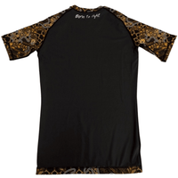Back view of Batik-X Inferno short sleeve rashguard, black rashguard with yellow and brown batik pattern