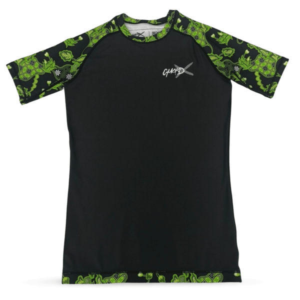 Batik-X Pulse short sleeve rashguard, front view, black compression top with green batik accents for BJJ and MMA