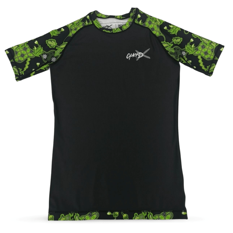 Batik-X Pulse short sleeve rashguard, front view, black compression top with green batik accents for BJJ and MMA