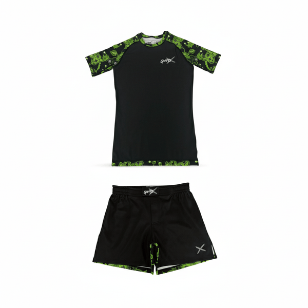 Batik-X Pulse short sleeve rashguard and matching fight shorts set, black compression top with green batik accents, designed for BJJ and MMA.