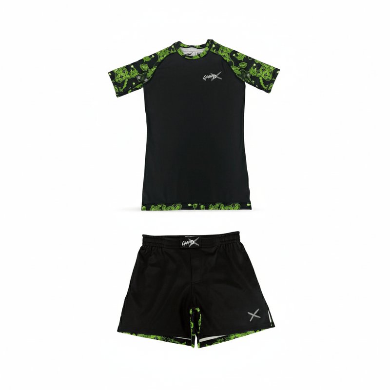 Batik-X Pulse short sleeve rashguard and matching fight shorts set, black compression top with green batik accents, designed for BJJ and MMA.