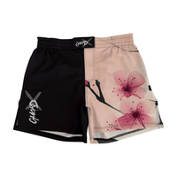 Women’s BJJ shorts with blossom design, front view, black fight shorts with pink floral print and elastic waistband