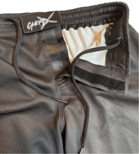 Close-up of Warrior-X fight shorts closure, velcro waistband with drawstring for secure fit